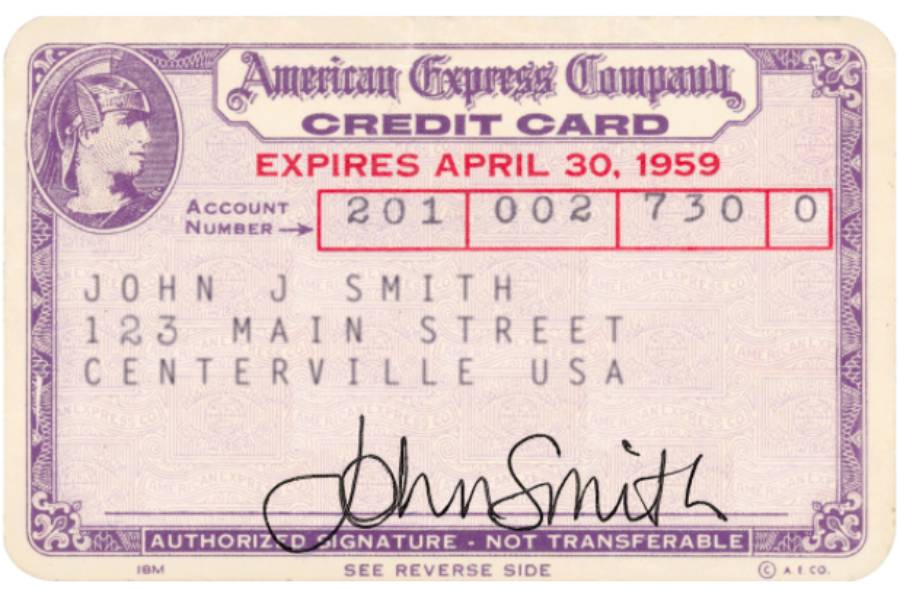 Vintage American Express credit card with purple borders, expiration date April 30, 1959, account number, and cardholder information for John J. Smith, 123 Main Street, Centerville, USA, plus a signature at the bottom.