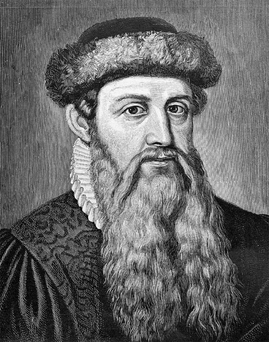 Black-and-white engraving of a man with a long beard, wearing a fur hat and a textured robe with a decorative collar, looking slightly to the side.