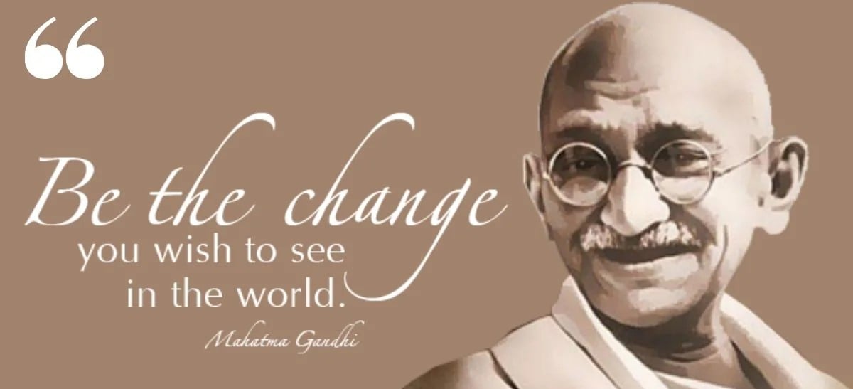 Illustration of Mahatma Gandhi smiling, with the quote: “Be the change you wish to see in the world. Mahatma Gandhi” written in white cursive on a brown background.