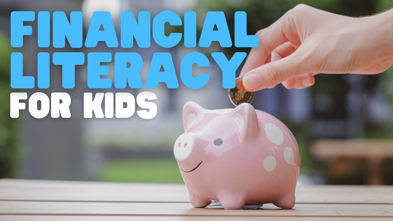 A hand places a coin into a pink piggy bank on a table. Bold text reads “Financial Literacy for Kids” in blue and white letters. The background is blurred greenery.