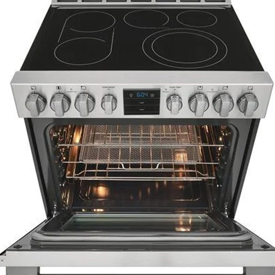 A stainless steel electric oven and stove with four burners, digital display, and six knobs. The oven door is open, showing wire racks inside.