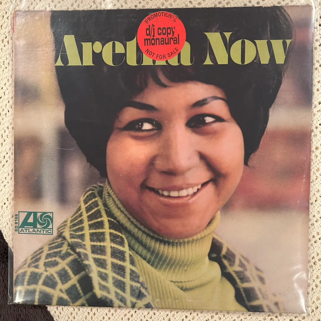 Album cover of “Aretha Now” by Aretha Franklin, showing a close-up of Aretha smiling. A red sticker reads “PROMOTIONAL dj copy monaural NOT FOR SALE.” The Atlantic Records logo is at the bottom left.