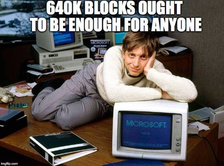 A young man in an office leans on a vintage computer displaying “Microsoft.” The text above reads, “640K BLOCKS OUGHT TO BE ENOUGH FOR ANYONE.”