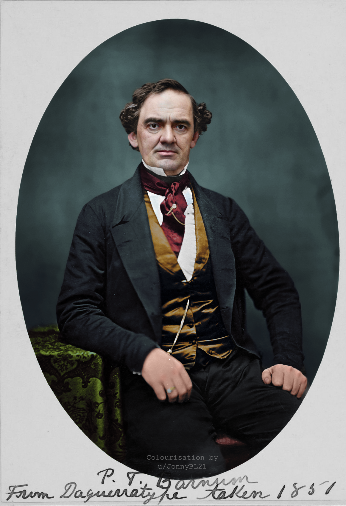 A colorized portrait of a seated man in 19th-century attire with a cravat and vest, one hand resting on a green patterned table, against a dark backdrop. Handwritten notes appear at the bottom of the image.