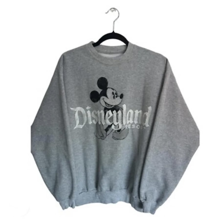Gray sweatshirt hanging on a hanger, featuring a graphic of Mickey Mouse and the words “Disneyland Resort” on the front, against a plain white background.