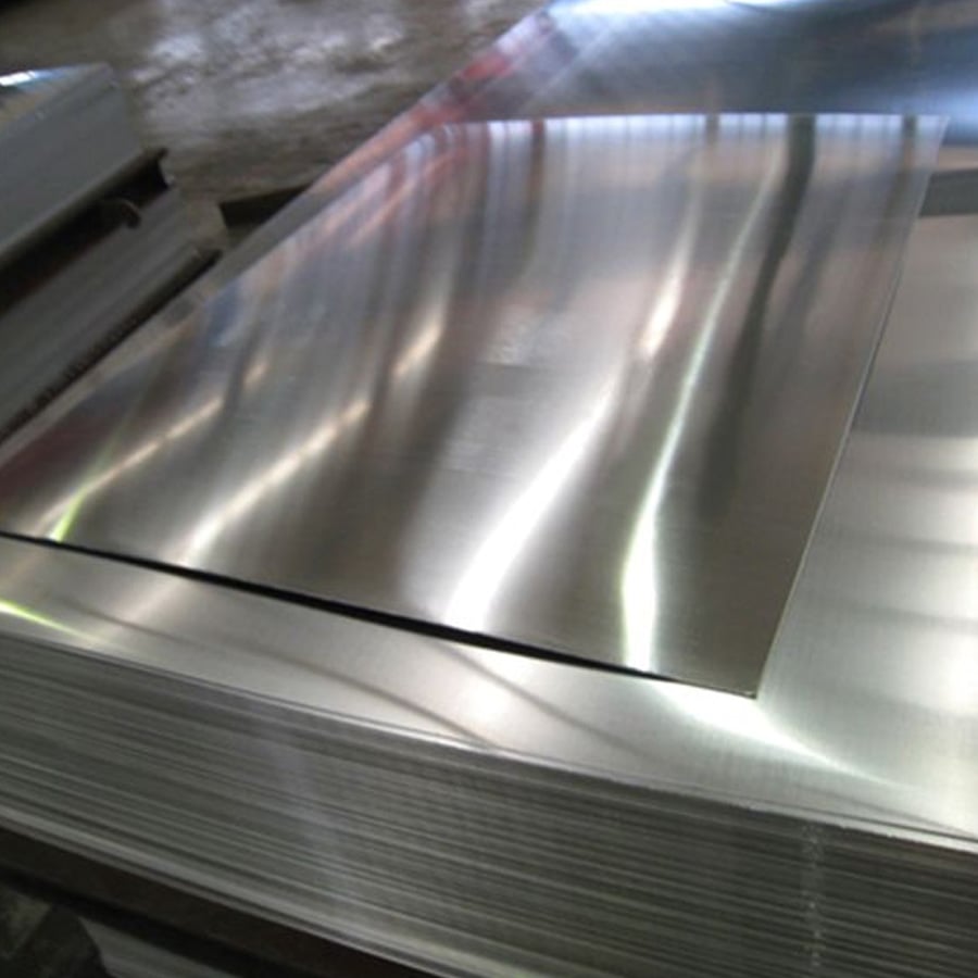 A stack of shiny, reflective metal sheets is shown, with one sheet slightly askew on top, highlighting their smooth surface and thin profile.