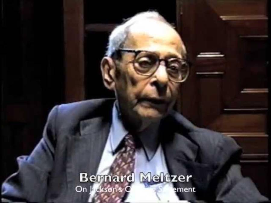 An elderly man in a suit and tie sits indoors. He wears glasses and looks slightly to the side. Text at the bottom reads: “Bernard Meltzer On Jackson’s Cross-Examination.”