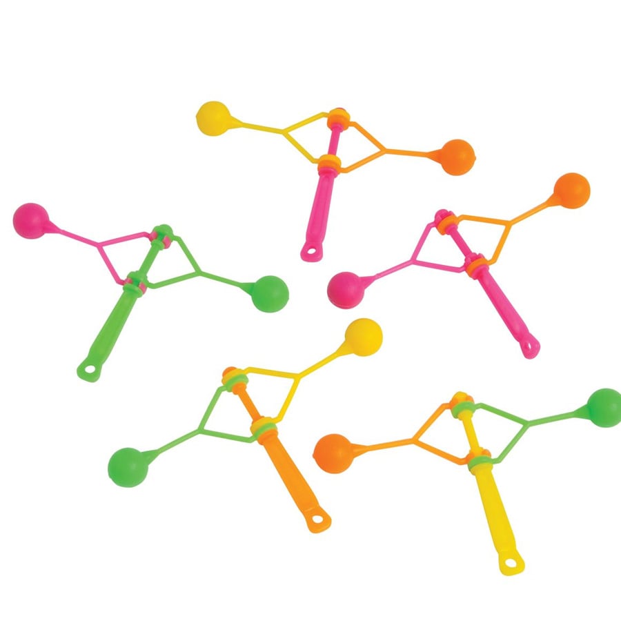 Five colorful plastic spinning noise makers with two round ends, in green, pink, orange, and yellow, arranged on a white background.