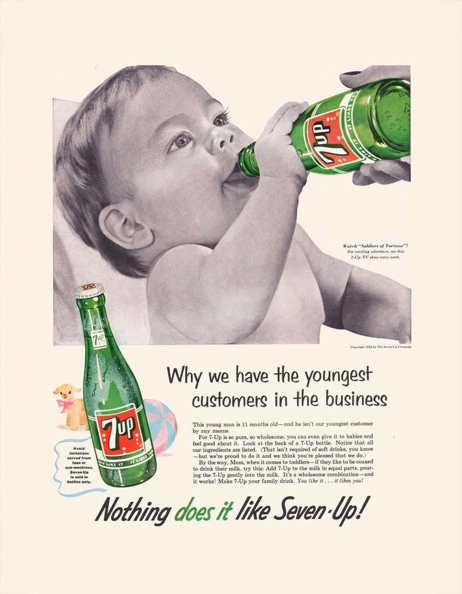 A baby drinks from a green glass 7 Up bottle held by an adult. The ad claims even young children enjoy 7 Up and features text explaining why young people are the brand’s customers.