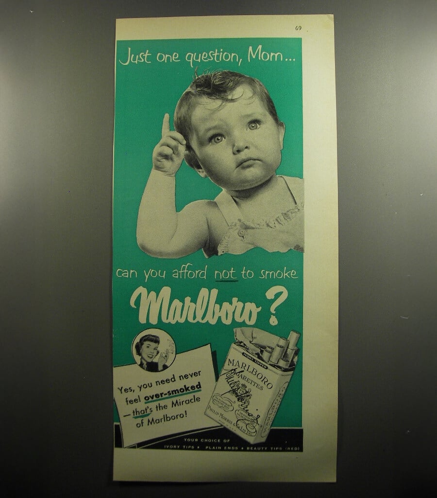 Vintage Marlboro ad with a baby pointing up, text reads: “Just one question, Mom... can you afford not to smoke Marlboro?” with a pack of Marlboro cigarettes and slogan about not feeling over-smoked.
