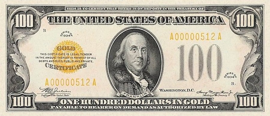 A vintage U.S. $100 gold certificate featuring Benjamin Franklin’s portrait in the center, a large gold seal on the left, and serial number A00000512A. Text reads “ONE HUNDRED DOLLARS IN GOLD.”