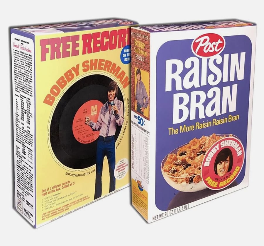 Two vintage Raisin Bran cereal boxes promote a free Bobby Sherman record. One box front shows Bobby Sherman and a record; the other features a cereal bowl, logo, and free record offer.