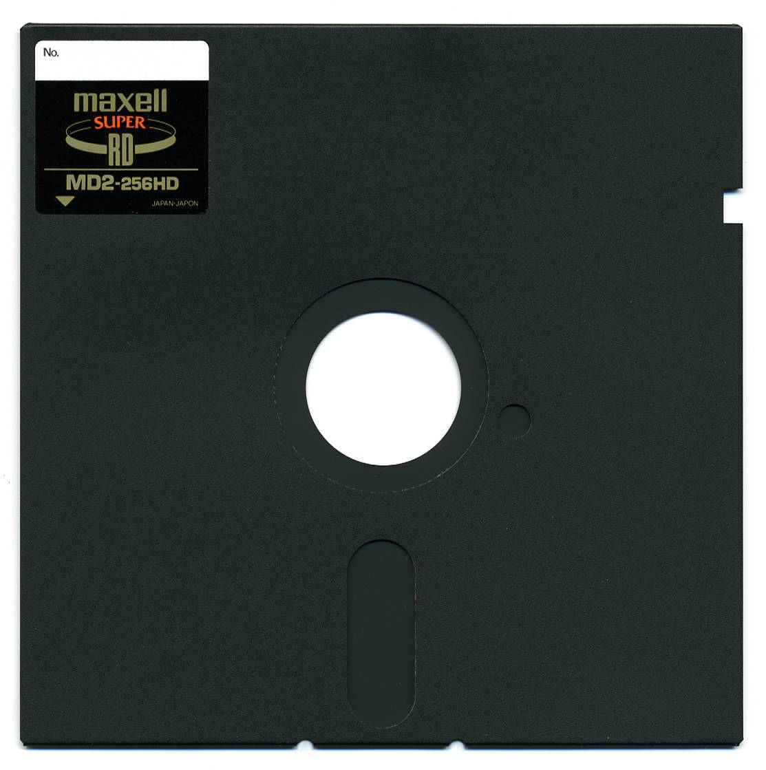 A black Maxell 5.25-inch floppy disk with a central hole, a label in the upper left corner, and a rectangular notch on the right edge.