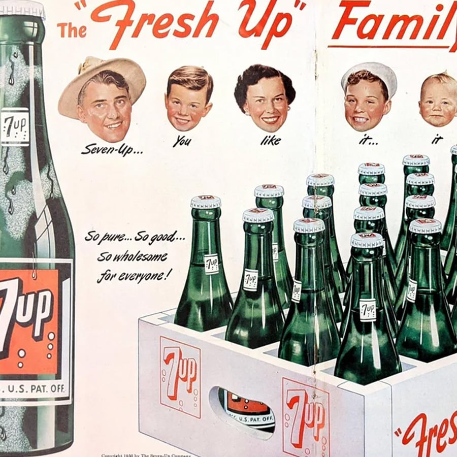 Vintage 7 Up advertisement shows floating family faces above a bottle and a case of 7 Up with the slogan: “The ‘Fresh Up’ Family. So pure... So good... So wholesome for everyone!”