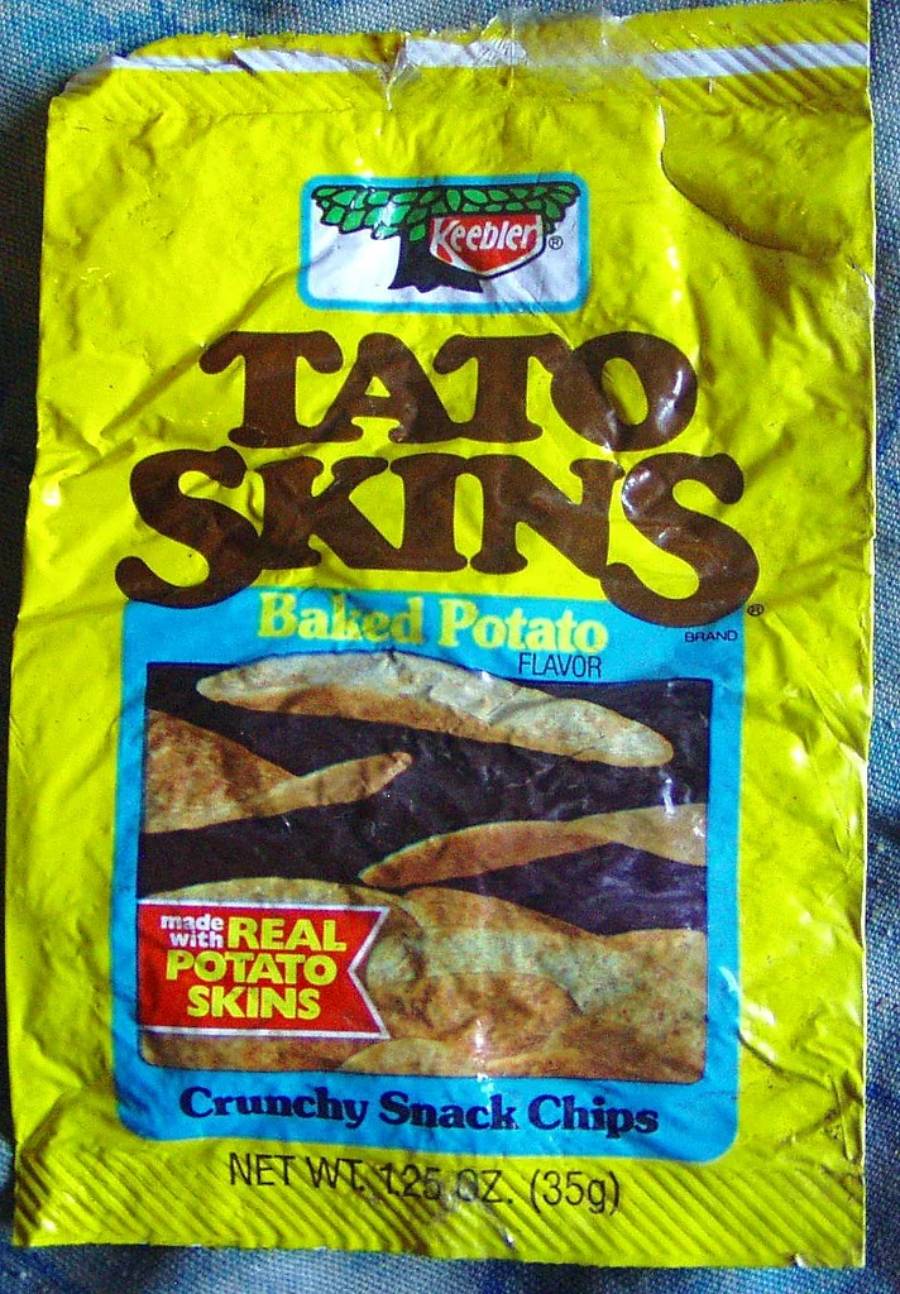 Yellow bag of Keebler Tato Skins Baked Potato flavor chips, showing images of chips and text: “Made with real potato skins” and “Crunchy Snack Chips.” Net weight is 1.25 oz (35g).