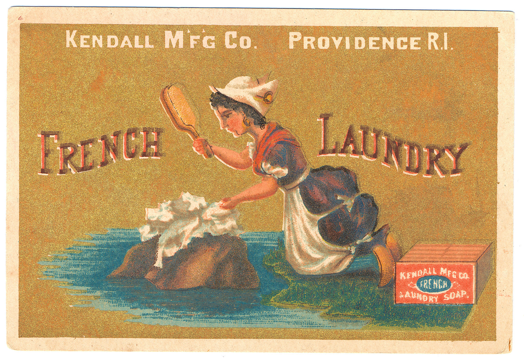 A woman in traditional dress washes clothes on a rock by water, with “French Laundry” text. Box labeled “Kendall Mfg Co. French Laundry Soap” and “Kendall Mfg Co. Providence R.I.” in background.