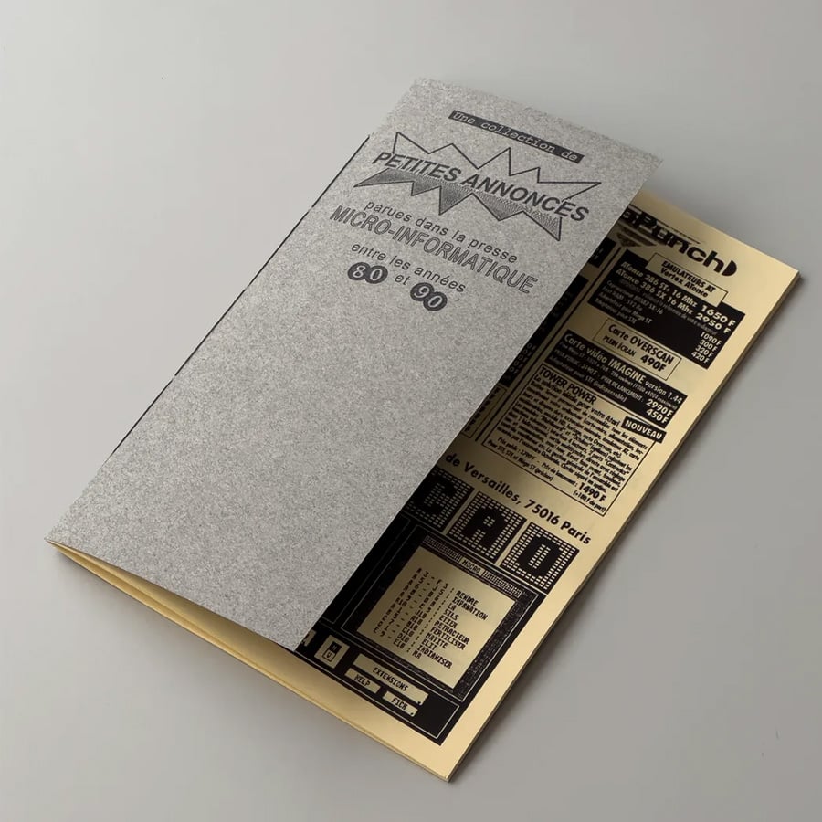 A vintage-style booklet partially opened, revealing a printed page with classified ads in French related to computers and technology from the 1980s to 1990s. The cover is gray with black text.