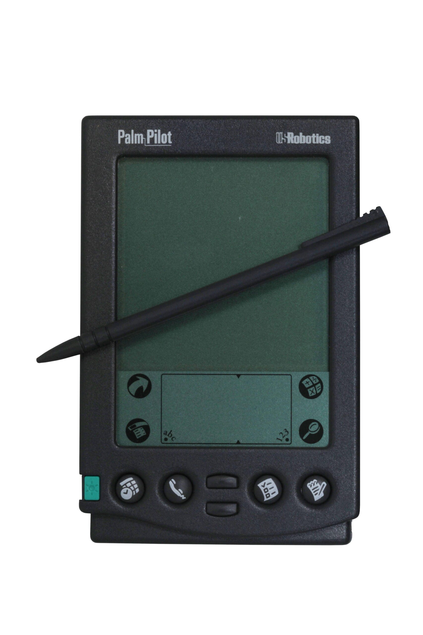 A black PalmPilot personal digital assistant with a stylus resting diagonally across its screen. The device has several buttons and a small green button on the lower left corner.