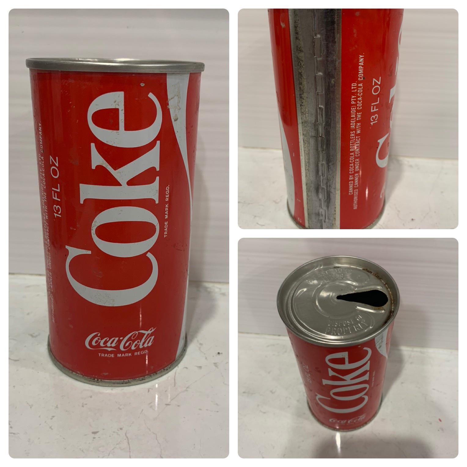 A vintage red Coca-Cola can with white lettering, showing front, back, and top views. The can has a pull-tab opening and holds 13 fluid ounces.