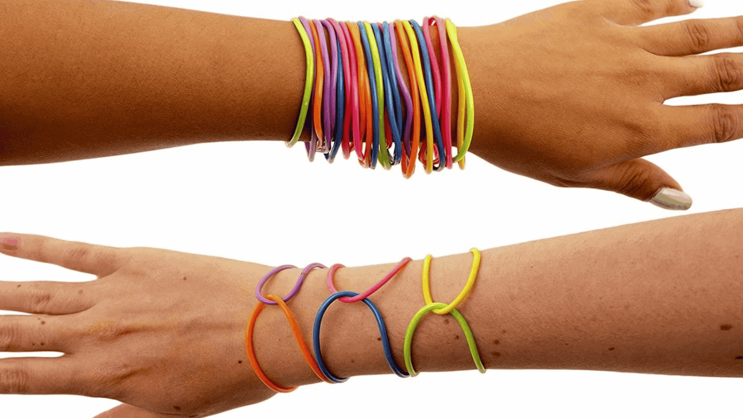 Two arms are shown wearing colorful silicone bracelets. The top arm has many stacked bracelets, while the lower arm wears fewer, spaced-apart bracelets. The bracelets are in assorted bright colors.