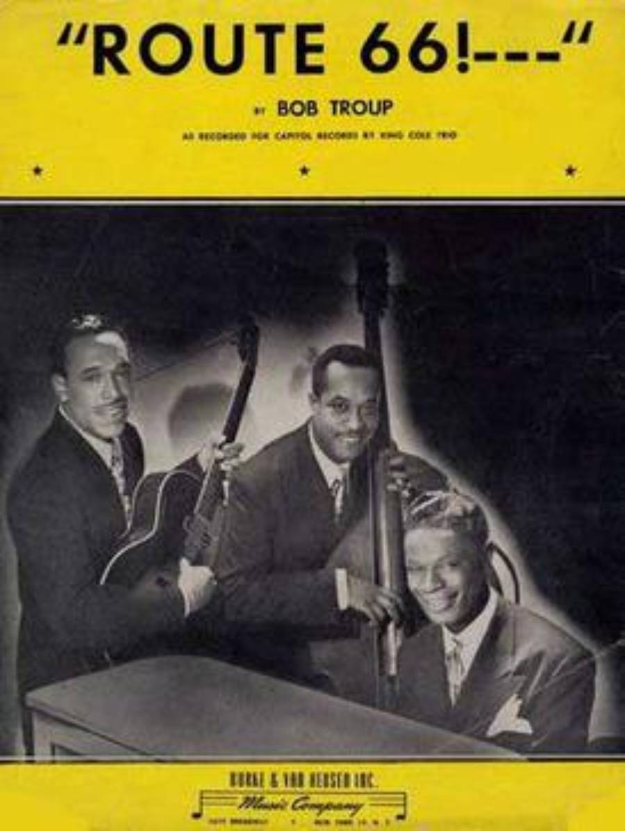 Vintage sheet music cover for “Route 66!” by Bob Troup, featuring a black-and-white photo of three men with musical instruments—a guitar, double bass, and piano—smiling at the camera.