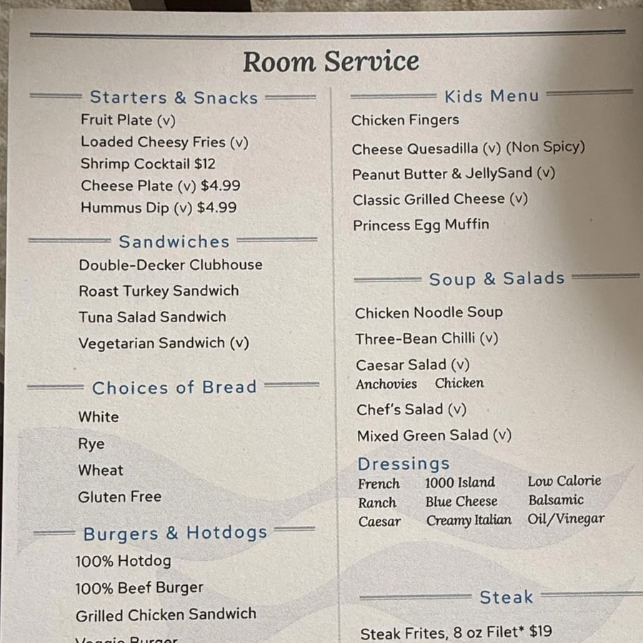 A hotel room service menu featuring sections for starters, sandwiches, breads, burgers, a kids menu, soups, salads, dressings, and steak options with various prices listed.