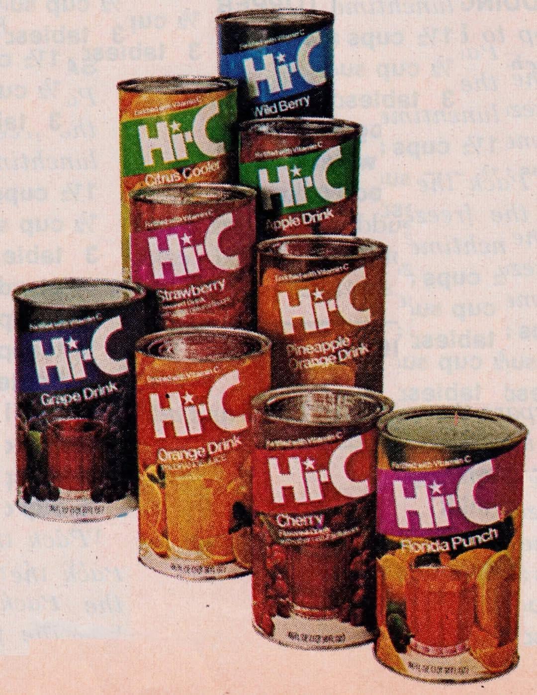 Nine vintage cans of Hi-C juice in various flavors, including Citrus Cool, Wild Berry, Grape, Strawberry, Orange, Pineapple Orange, Cherry, and Florida Punch, are stacked in three rows.