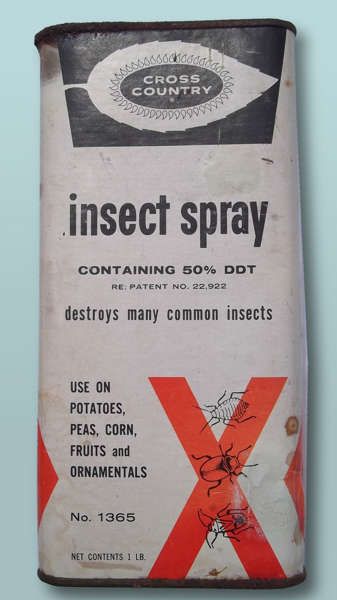 Vintage Cross Country insect spray can with bold text, advertising 50% DDT content, for use on potatoes, peas, corn, fruits, and ornamentals; includes insect illustrations and red X graphics.