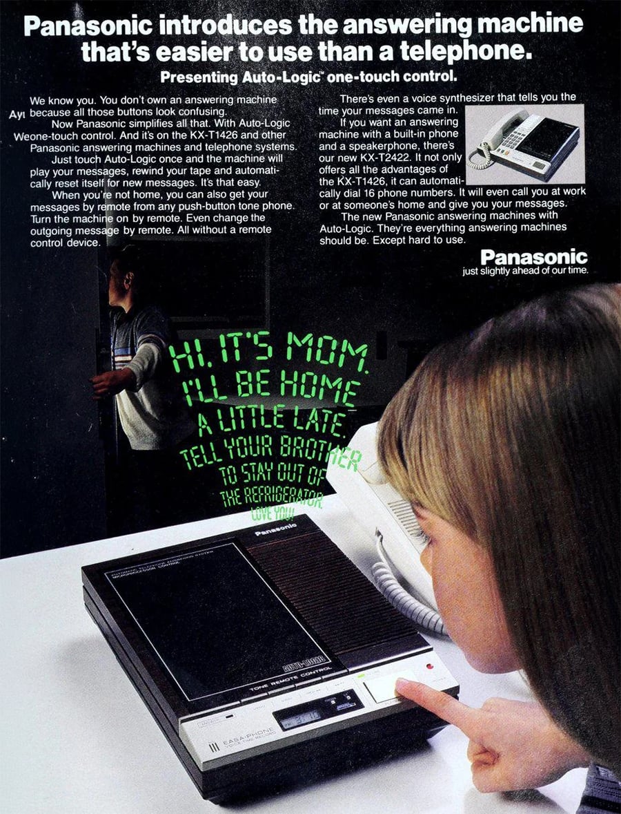 A girl listens to a Panasonic answering machine as a glowing green message appears on the wall behind her: “HI, IT’S MOM! I’LL BE HOME A LITTLE LATE. TELL YOUR BROTHER TO STAY OUT OF THE REFRIGERATOR.”