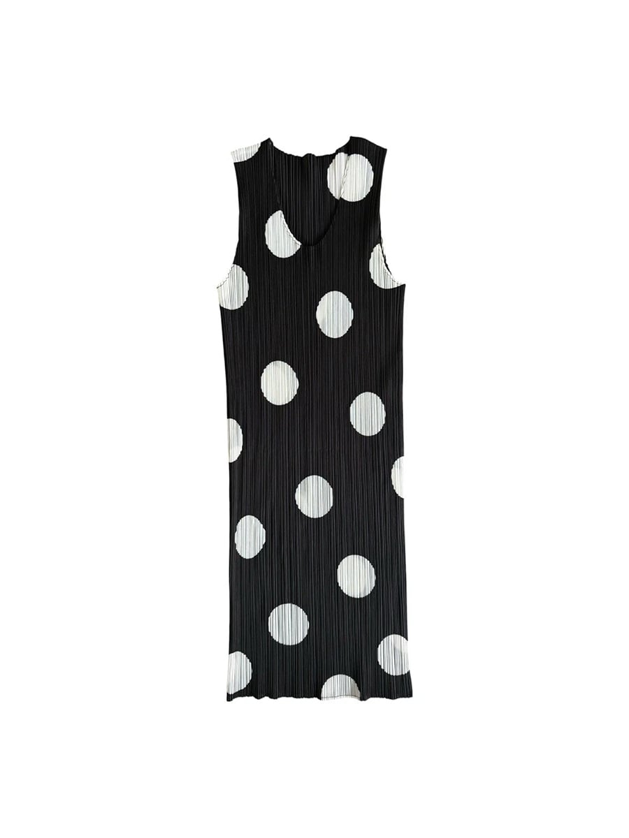 Sleeveless, knee-length black dress with large white polka dots and a pleated texture, displayed on a plain white background.