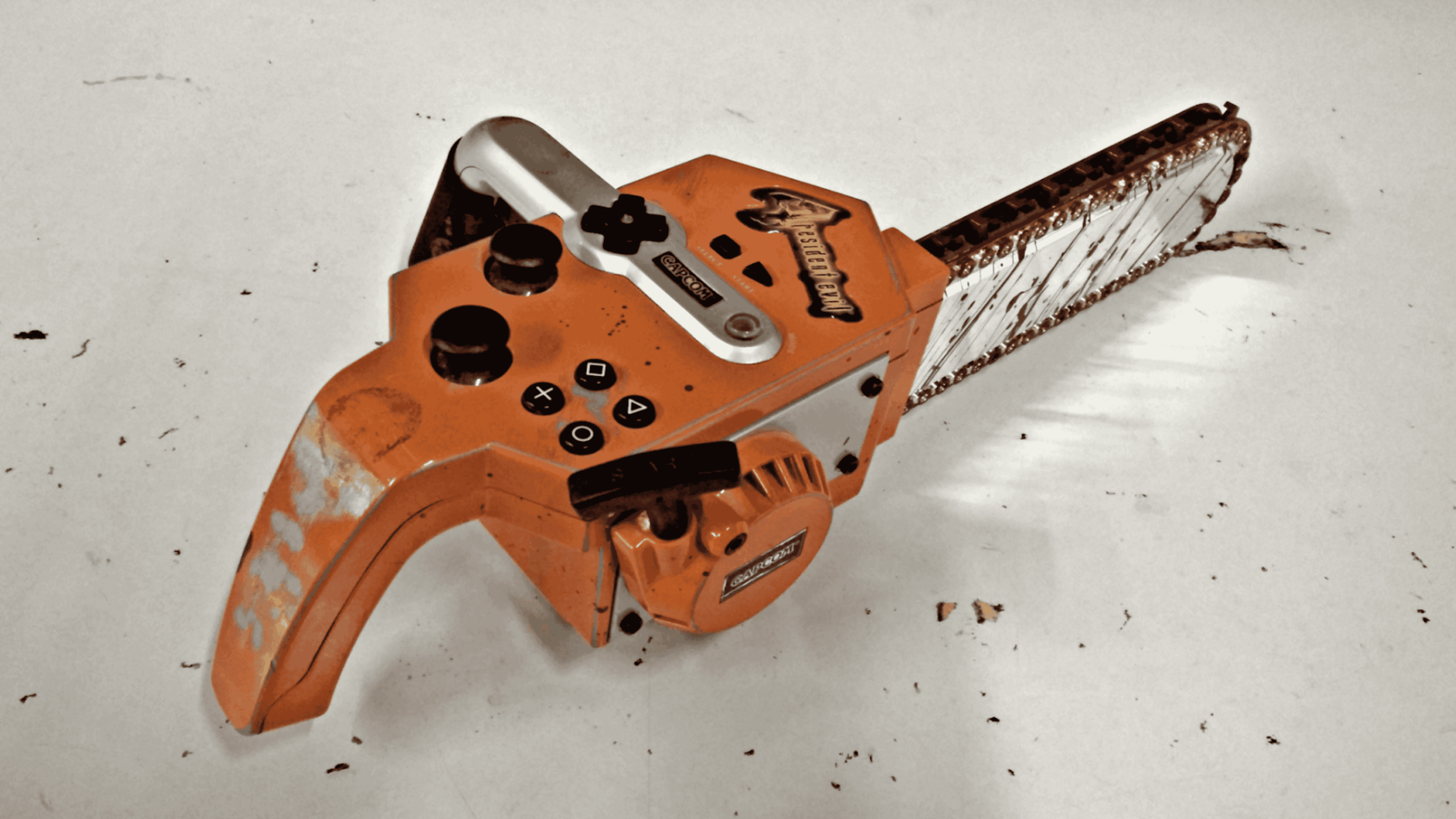 Resident Evil 4 themed chainsaw video game controller for PlayStation.