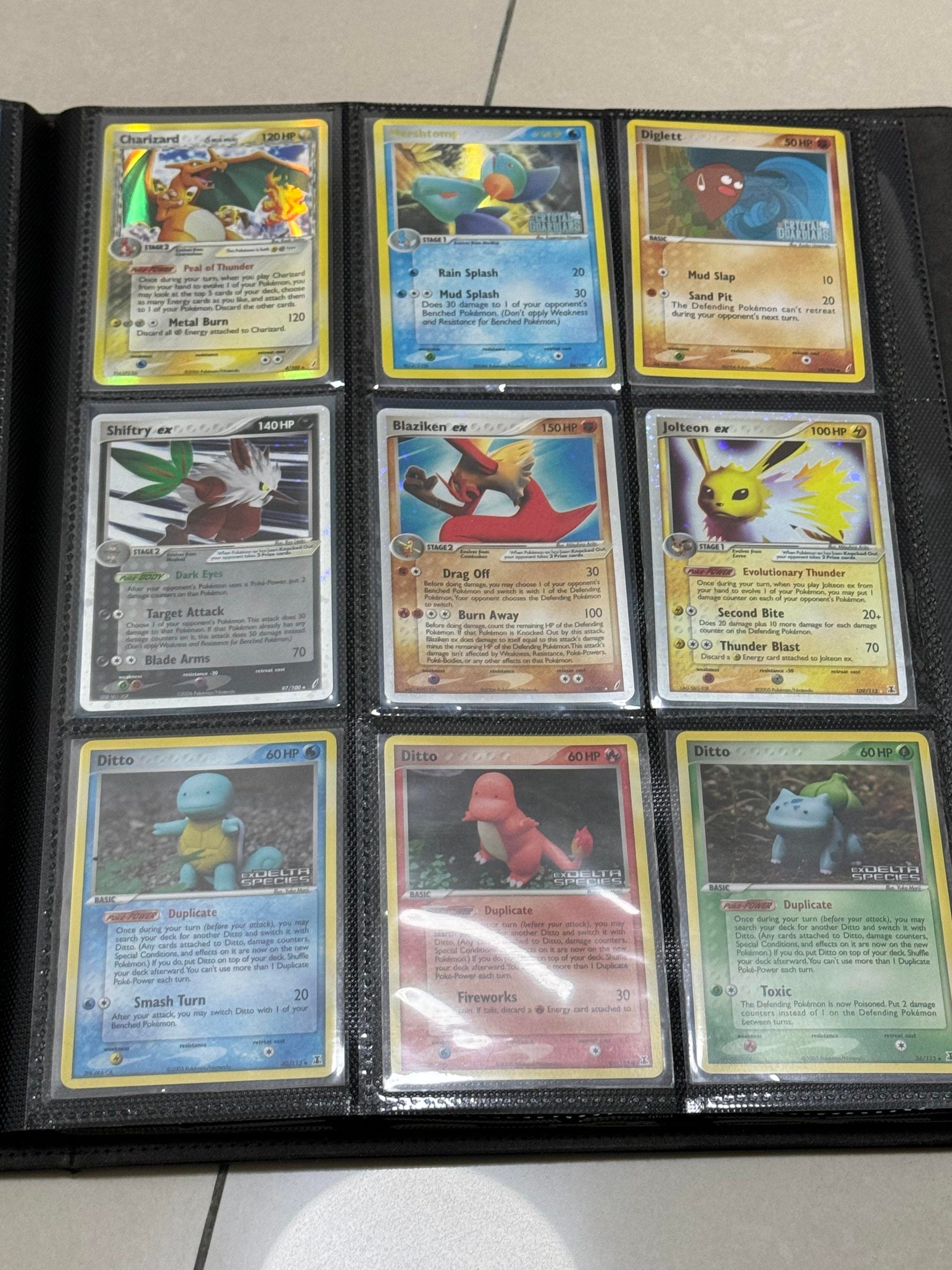 Nine Pokémon trading cards displayed in a plastic binder sleeve, including Charizard, Blaziken, Jolteon, and three different Ditto cards.