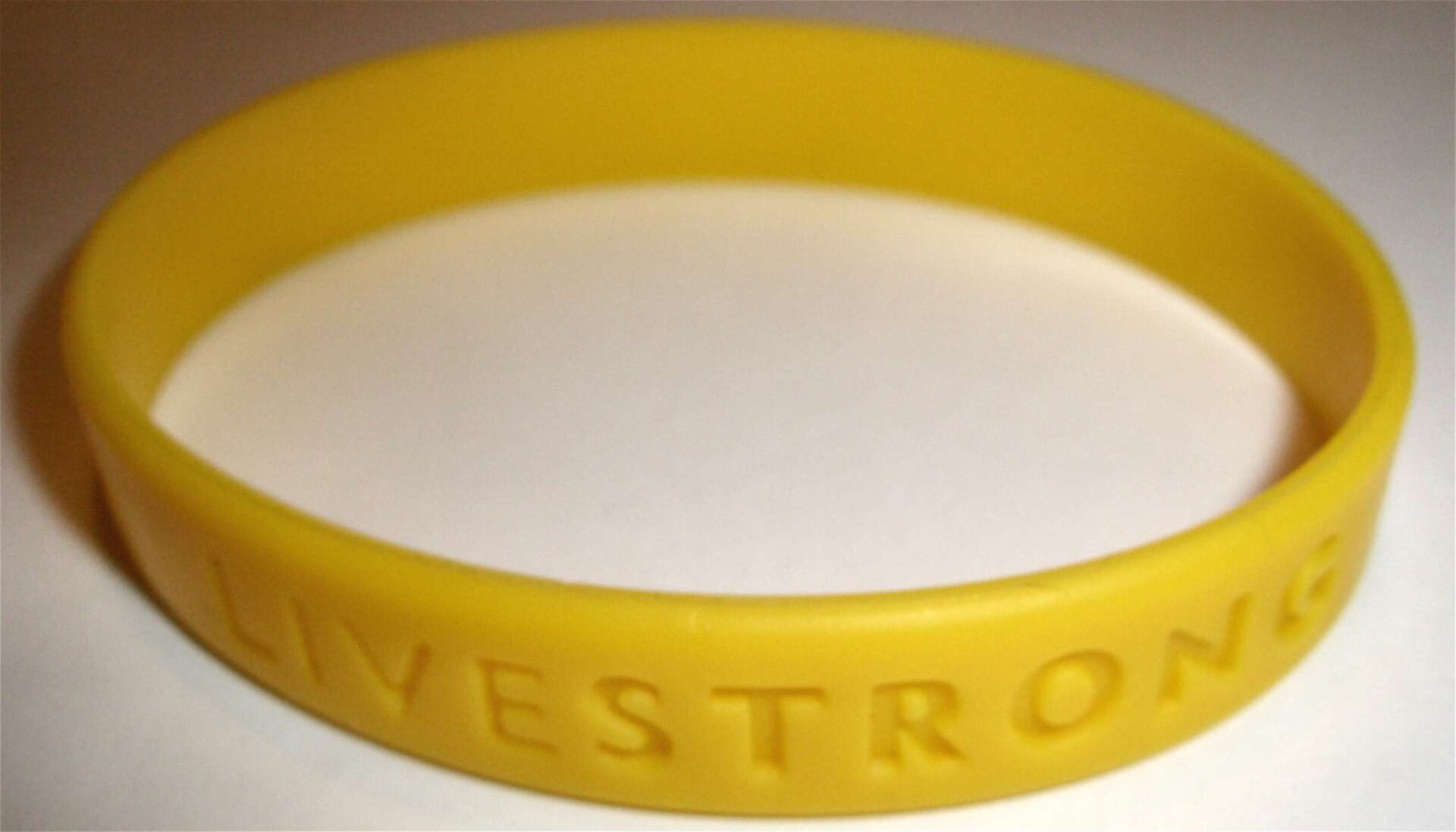 Yellow Livestrong silicone wristband.
