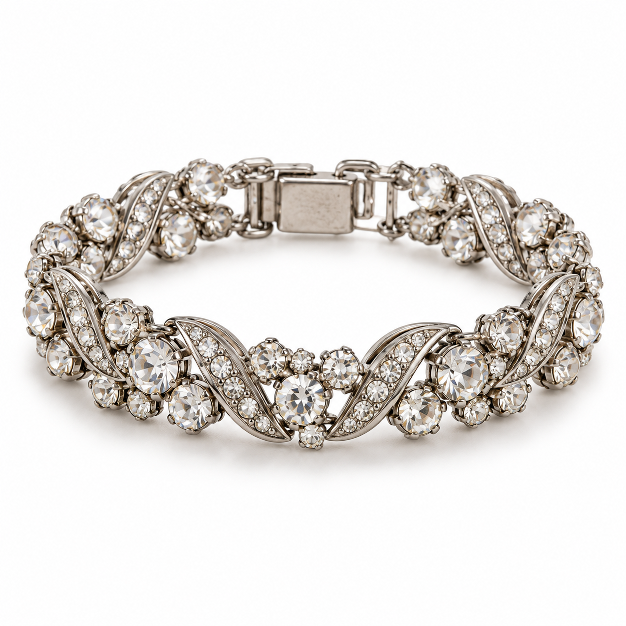 Silver-toned bracelet featuring a repeating pattern of interwoven metal bands set with round, clear stones.
