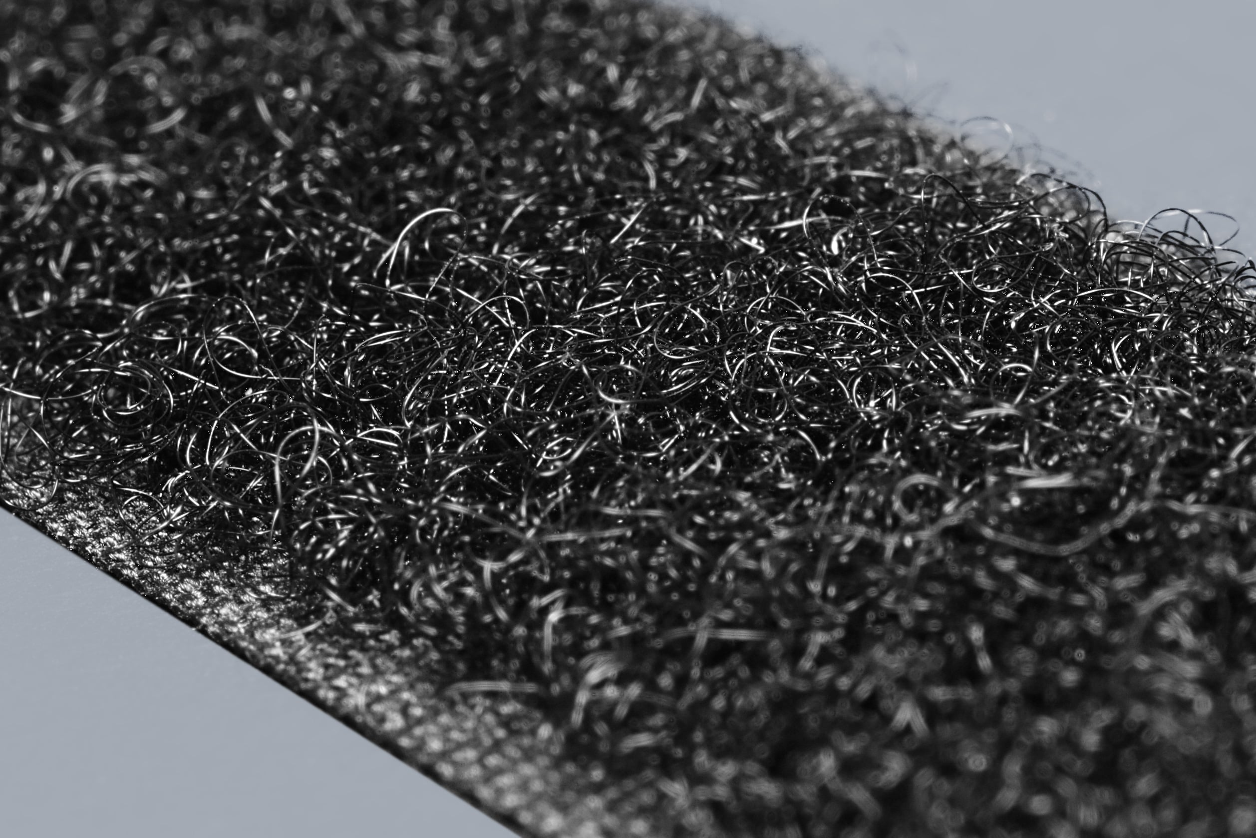 Close-up of black hook-and-loop fastener fabric.