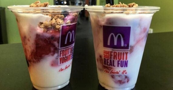 Two plastic cups of McDonald’s fruit and yogurt parfaits topped with granola.