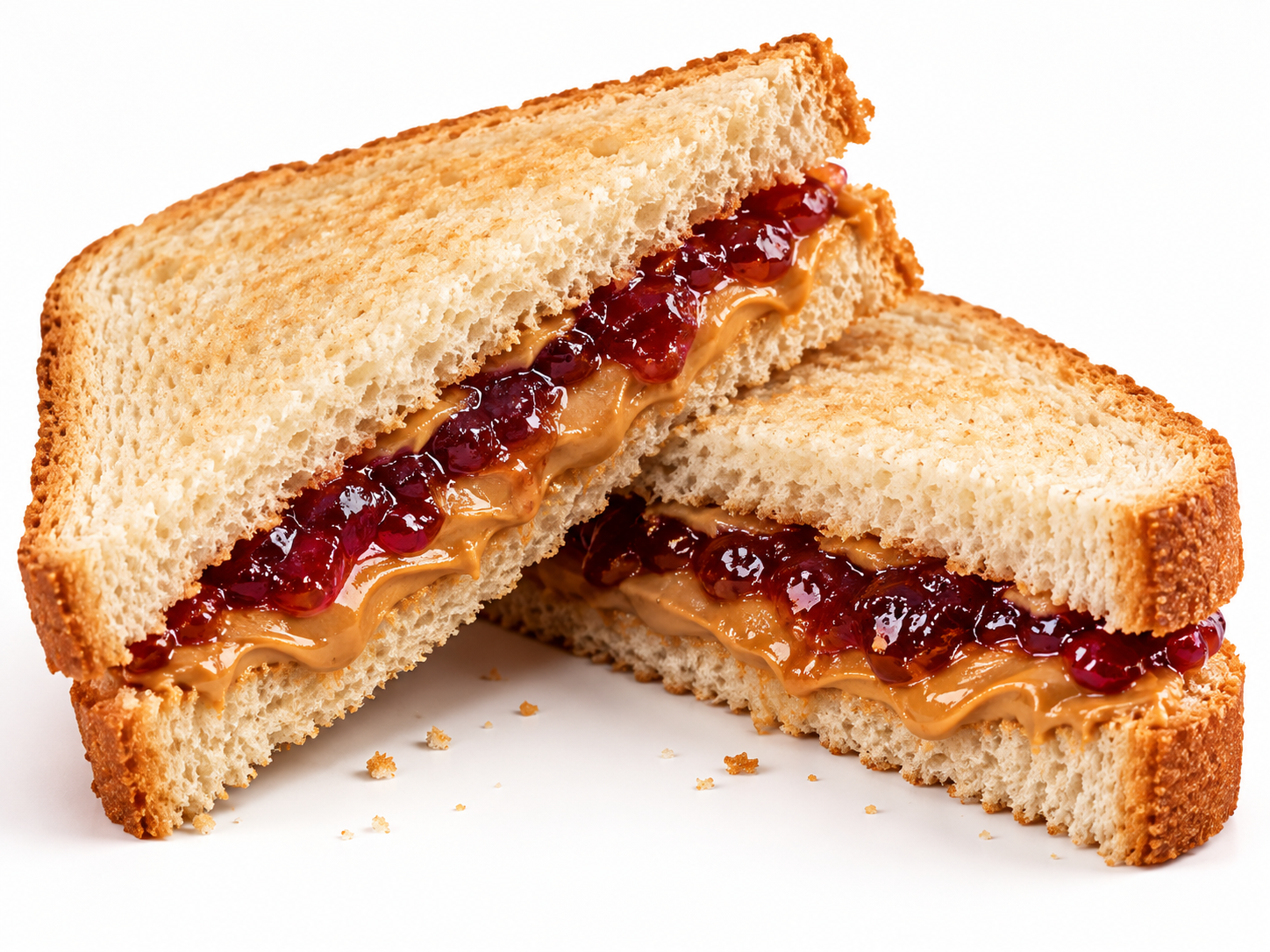 A peanut butter and jelly sandwich cut in half on toasted bread.