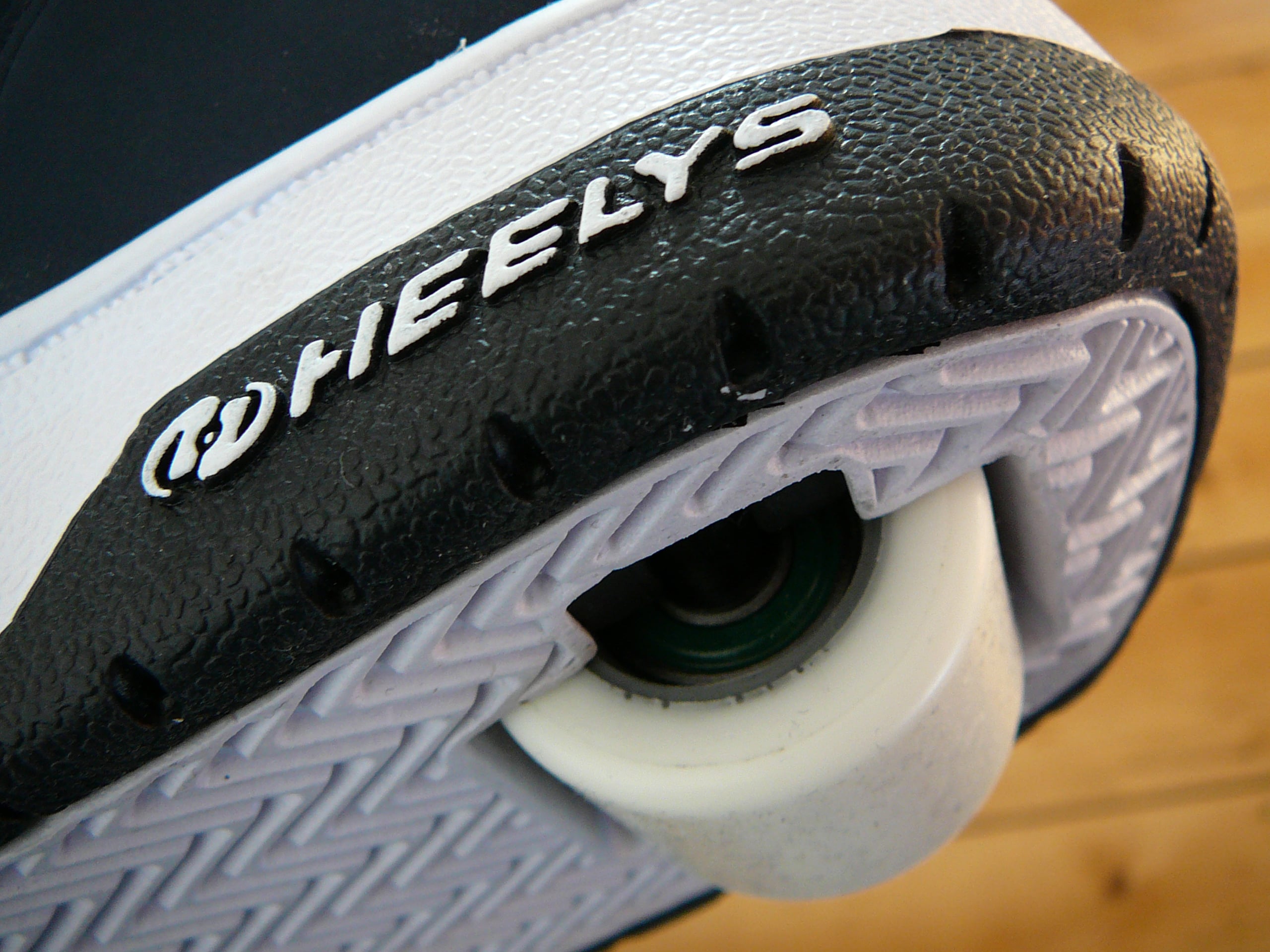 Close-up of the heel of a Heelys shoe, showing the removable wheel integrated into the sole.