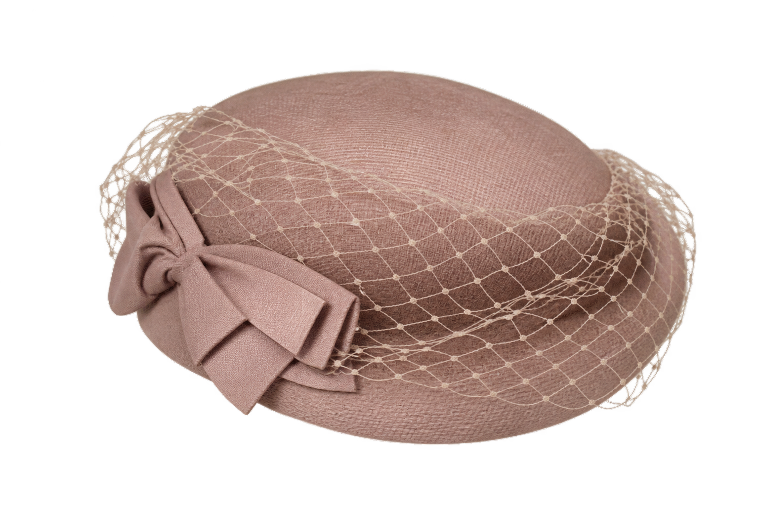 Dusty pink pillbox hat with a matching bow and a dotted netting veil.
