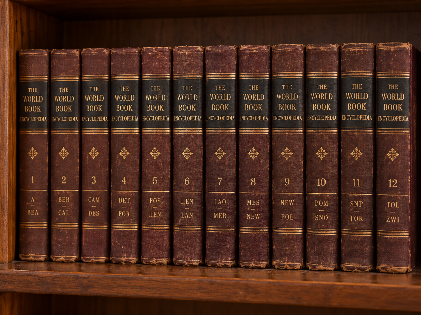 A complete, twelve-volume set of vintage The World Book Encyclopedia standing in order on a wooden bookshelf.