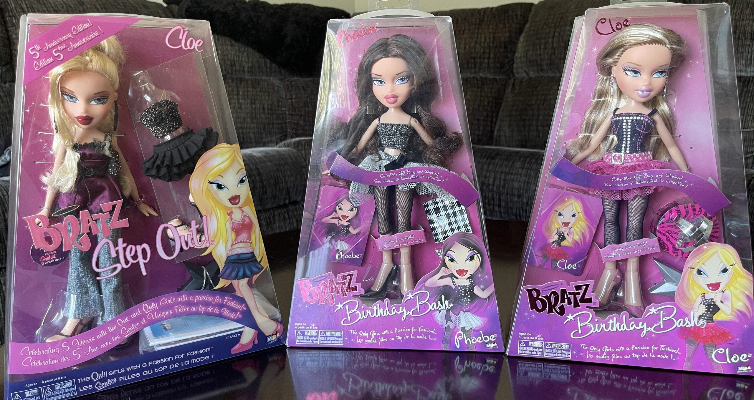 Three Bratz dolls in their original packaging: Cloe Step Out, Phoebe Birthday Bash, and Cloe Birthday Bash.
