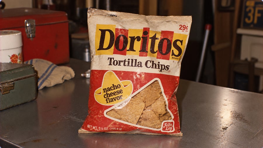 A vintage bag of Nacho Cheese flavored Doritos tortilla chips, priced at 29 cents.