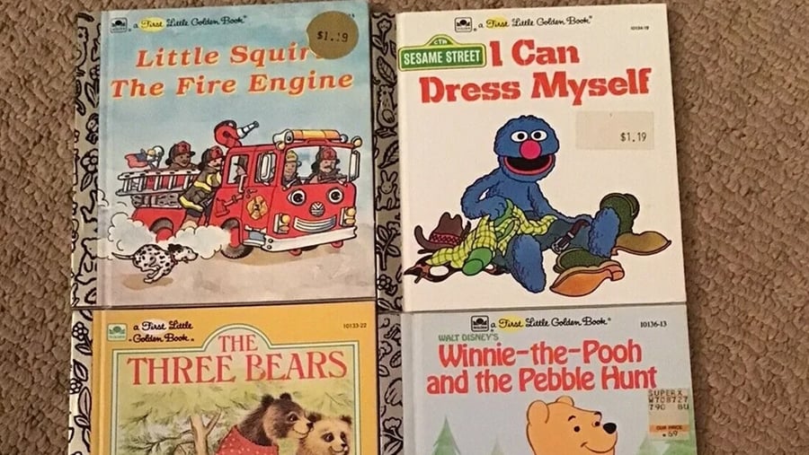 Four First Little Golden Books titled Little Squirt The Fire Engine, I Can Dress Myself, The Three Bears, and Winnie-the-Pooh and the Pebble Hunt.