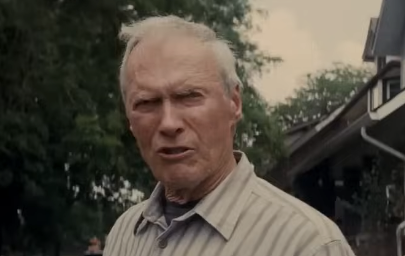 Clint Eastwood looking directly at the camera with a serious expression.