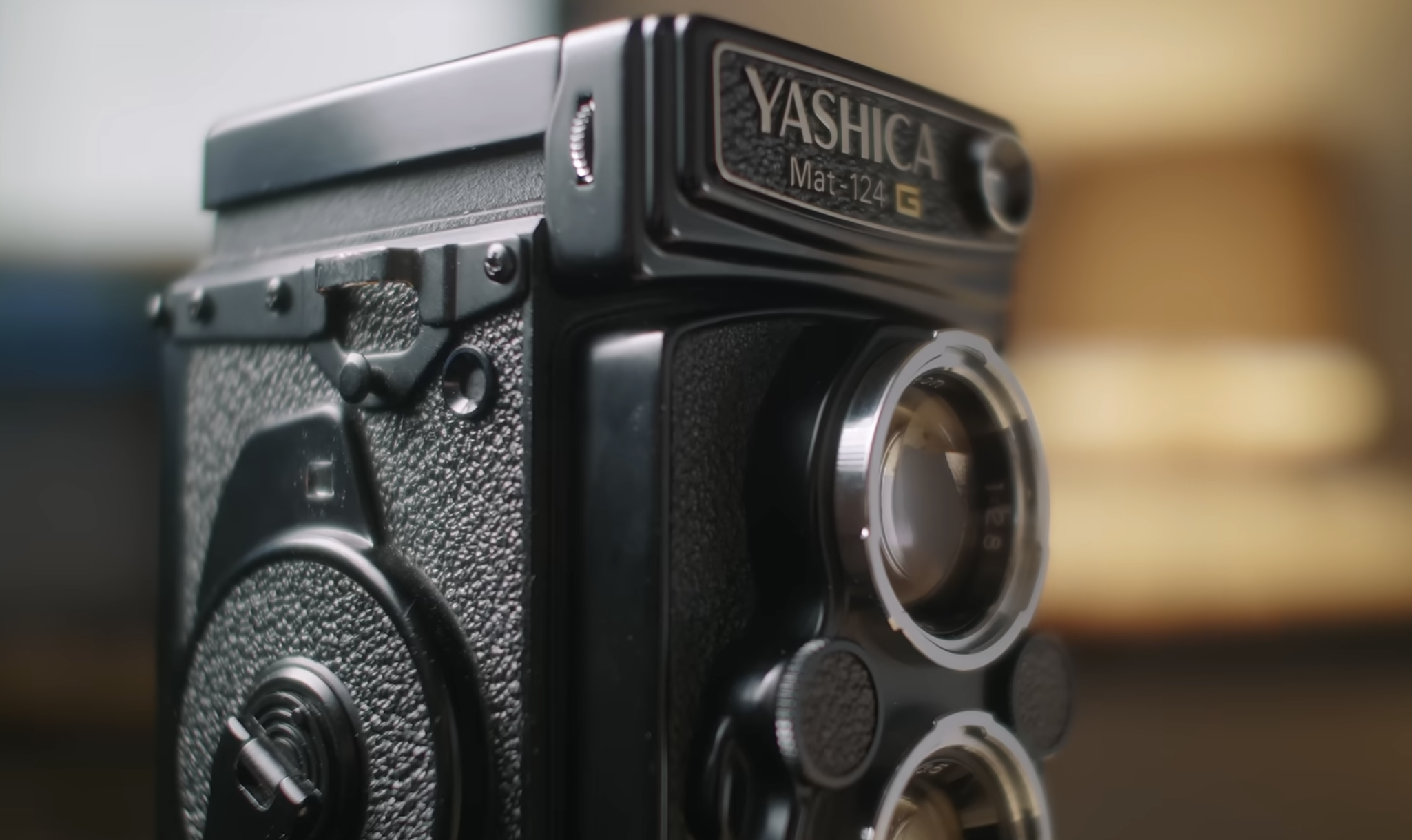Close-up of a black Yashica Mat-124 G twin-lens reflex camera.