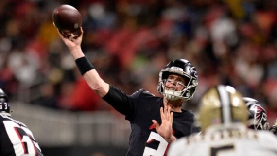 An Atlanta Falcons quarterback throwing a football during a game.