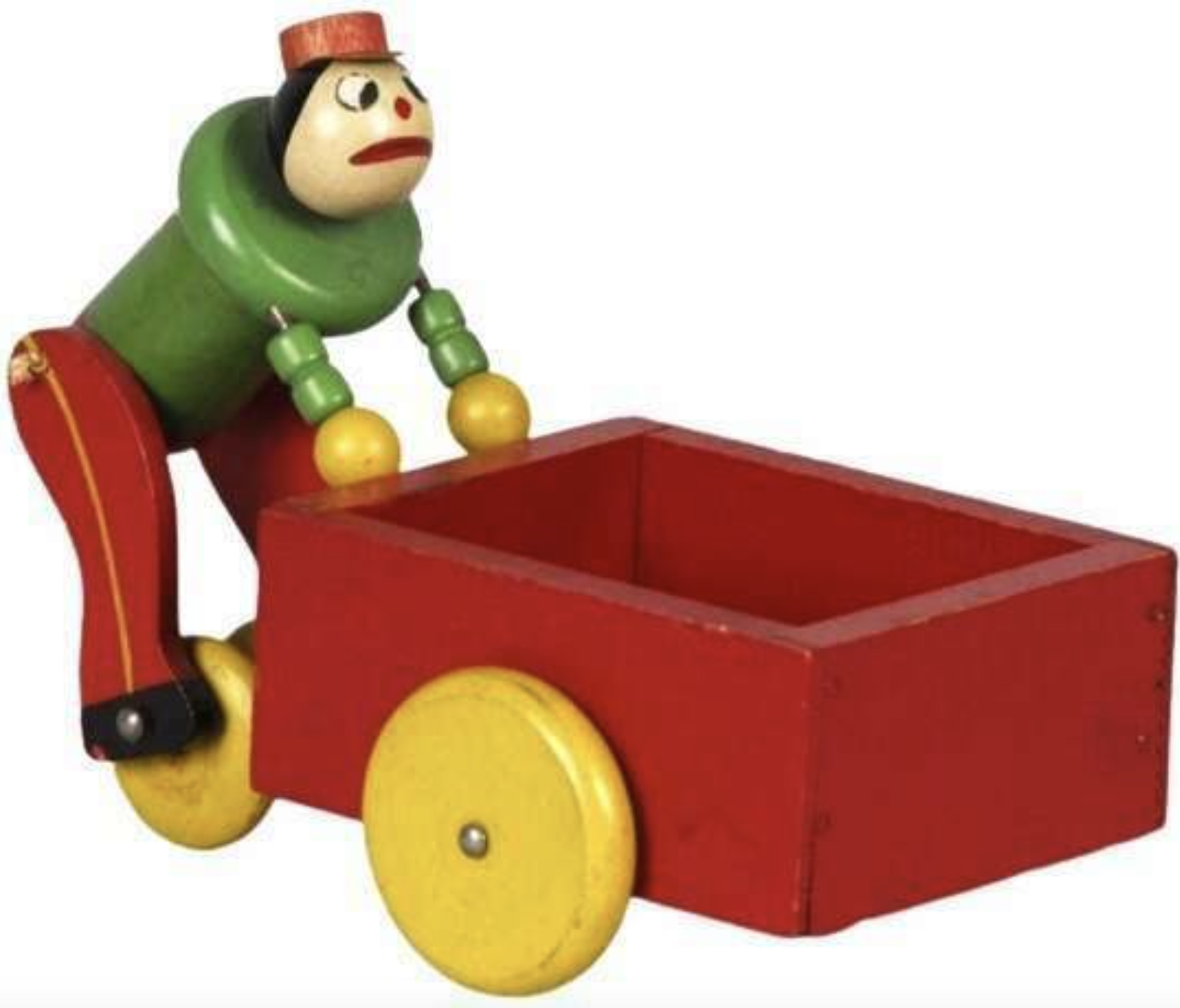 A wooden pull toy shaped like a clown pushing a red cart with yellow wheels.
