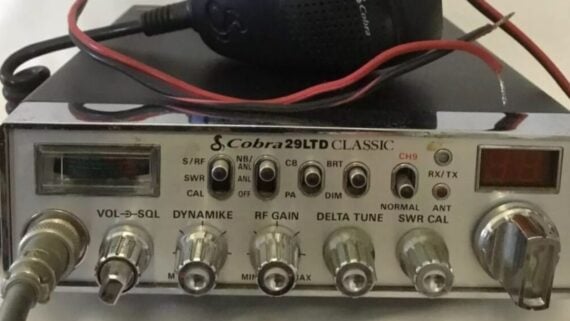 Cobra 29LTD CLASSIC CB radio with knobs, switches, and a handheld microphone.