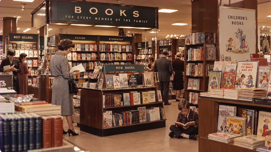 Customers browse a vintage bookstore with shelves labeled “Fiction,” “Biography,” and “Children’s Books,” while a young boy reads on the floor.