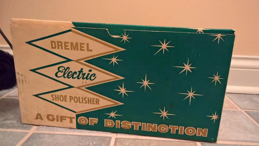 Vintage Dremel Electric Shoe Polisher box with teal and cream mid-century modern starburst design.